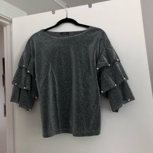 Sparkly ruffle top with pearls